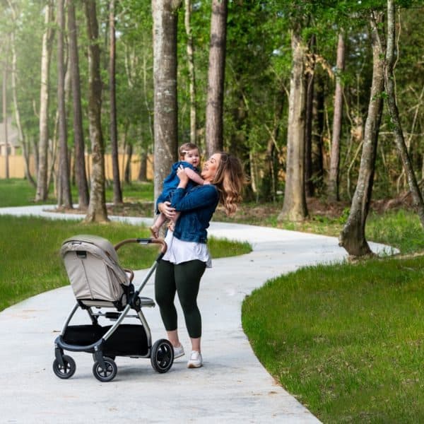 mom walking with daughter on paved trail