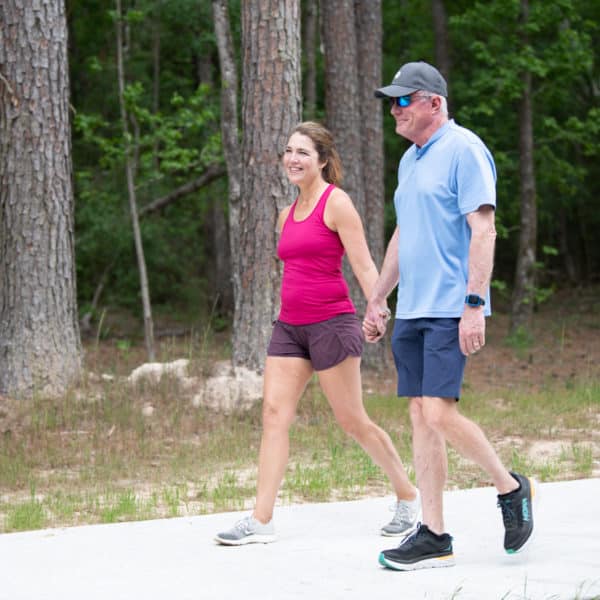 couple walking on paved trail