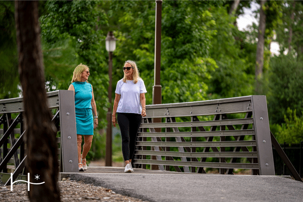 two women walking in an active adult retirement living in texas
